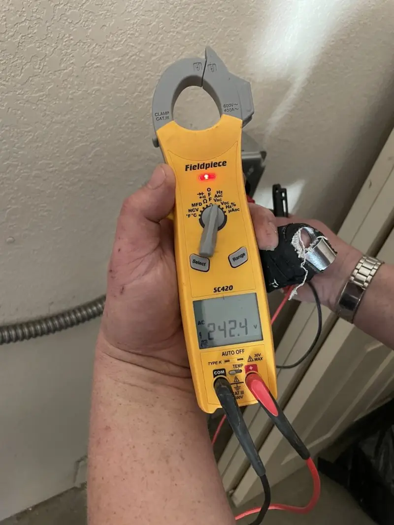 Voltage testing with clamp meter during Generator Installation in Lauderdale Lakes
